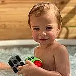 Peau, Eau, Sourire, Human Body, Jouets, Swimming Pool, Happy, Fun, Bambin, Chest, Leisure, Bathing, Enfant, Recreation, Baby Playing With Toys, Baby, Play, Carmine, Nail, Baby Products, Personne, Joy