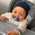 Visage, Facial Expression, Sourire, Comfort, Cap, Baby, Gesture, Finger, Baby & Toddler Clothing, Bambin, Sleeve, Thumb, Baby Sleeping, Enfant, Happy, Knit Cap, Baby Products, Baby Safety, Electric Blue, Personne, Headwear
