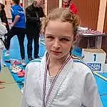 Hair, Visage, Joint, Head, Coiffure, Martial Arts Uniform, Sports Uniform, Japanese Martial Arts, Necklace, Recreation, Competition Event, Fun, Combat Sport, Event, Jewellery, Electric Blue, Championship, Uniform, Contact Sport, Martial Arts, Personne, Under Exposed