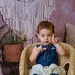 Sourire, Meubles, Plante, Textile, Dress, Happy, Chair, Baby & Toddler Clothing, Comfort, Bois, Bambin, Leisure, Assis, Herbe, Jewellery, Baby, Room, Enfant, Poil, Portrait Photography, Personne