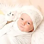 Joue, Peau, Sourire, Comfort, Baby & Toddler Clothing, Textile, Happy, Headgear, Baby Sleeping, Baby, Bambin, Cap, Enfant, Linens, Knit Cap, Wool, Poil, Stuffed Toy, Beanie, Room, Personne, Headwear