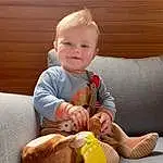 Head, Comfort, Sleeve, Jouets, Baby & Toddler Clothing, Bambin, Baby, Knee, Thumb, Lap, Couch, Happy, Bois, Stuffed Toy, Assis, Foot, Enfant, Baby Playing With Toys, Human Leg, Sourire, Personne, Joy