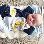 Clothing, Visage, Hand, Bras, Yeux, Facial Expression, Comfort, Baby & Toddler Clothing, Human Body, Textile, Sleeve, Baby, Baby Sleeping, Bambin, Linens, T-shirt, Baby Products, Bedtime, Sieste, Personne