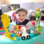 Sourire, Baby Playing With Toys, Happy, Bambin, Leisure, Recreation, Baby, Enfant, Fun, Event, Baby Products, Baby Toys, Assis, Play, Sweetness, Room, Party, Amusement Ride, Stuffed Toy, Party Supply, Personne, Joy, Headwear